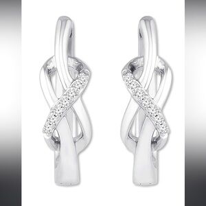 925 Silver With 10 genuine diamonds on each earring.